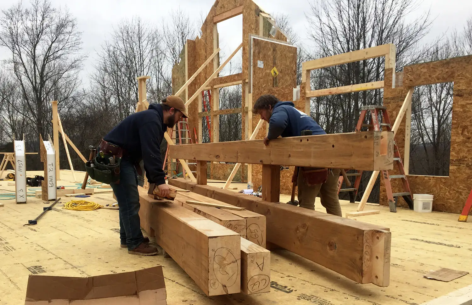 Contractor reviewing plans on a residential construction site